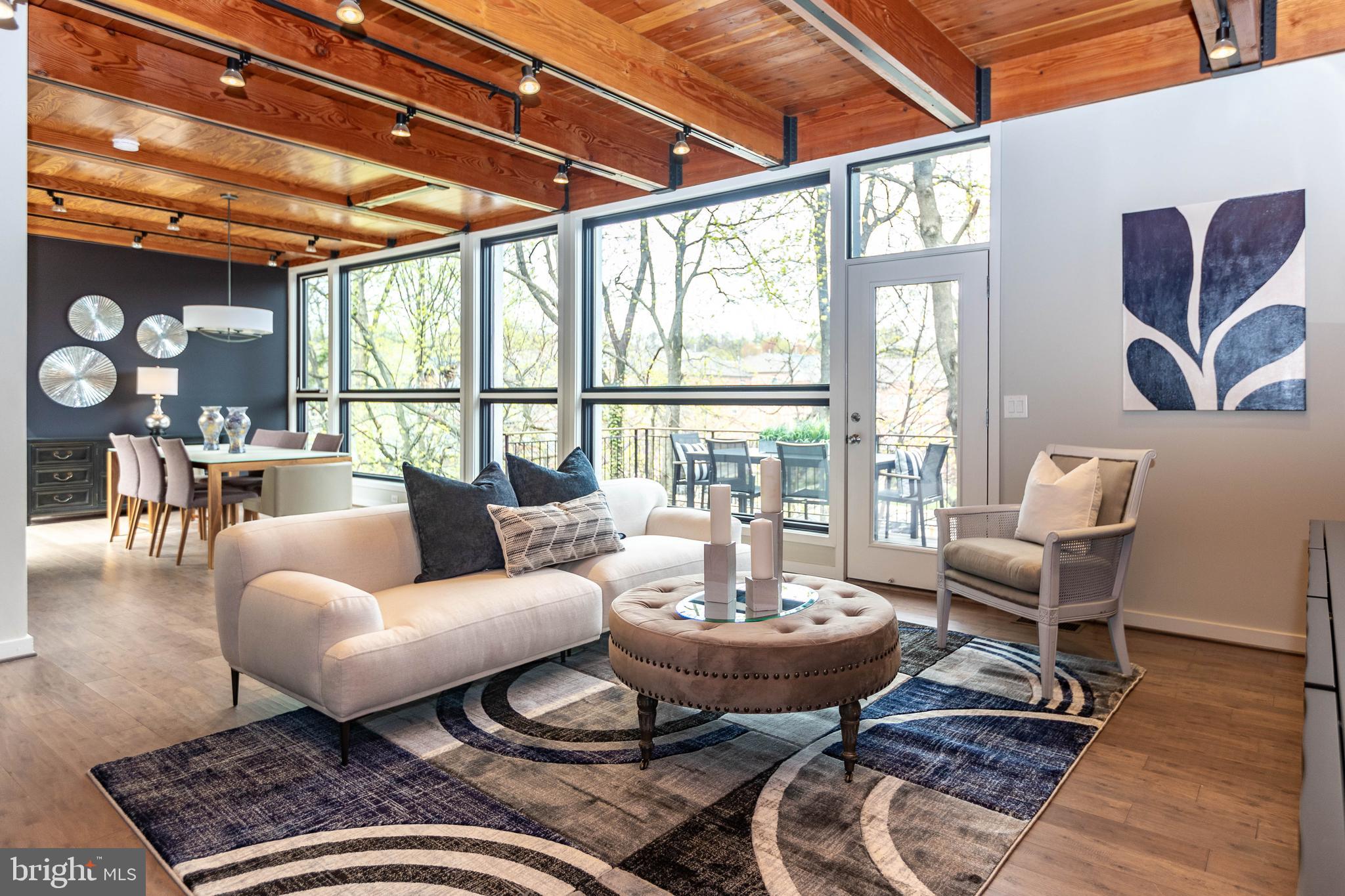 2074 Eric Shaefer Way Baltimore, MD 21211 - Photo 56 of 56 a living room with furniture and wooden floor
