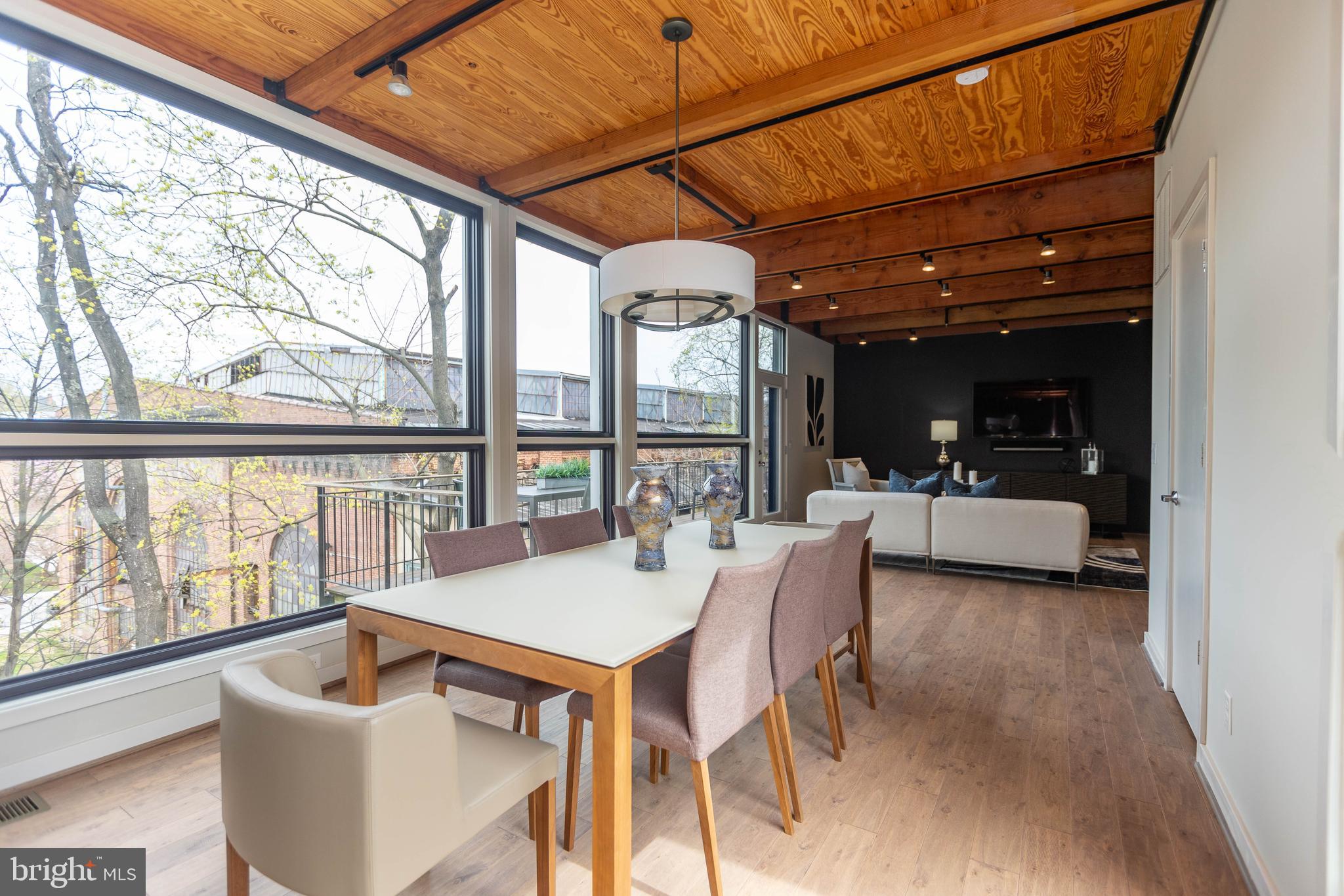 2074 Eric Shaefer Way Baltimore, MD 21211 - Photo 14 of 56 a dining room with furniture and a floor to ceiling window