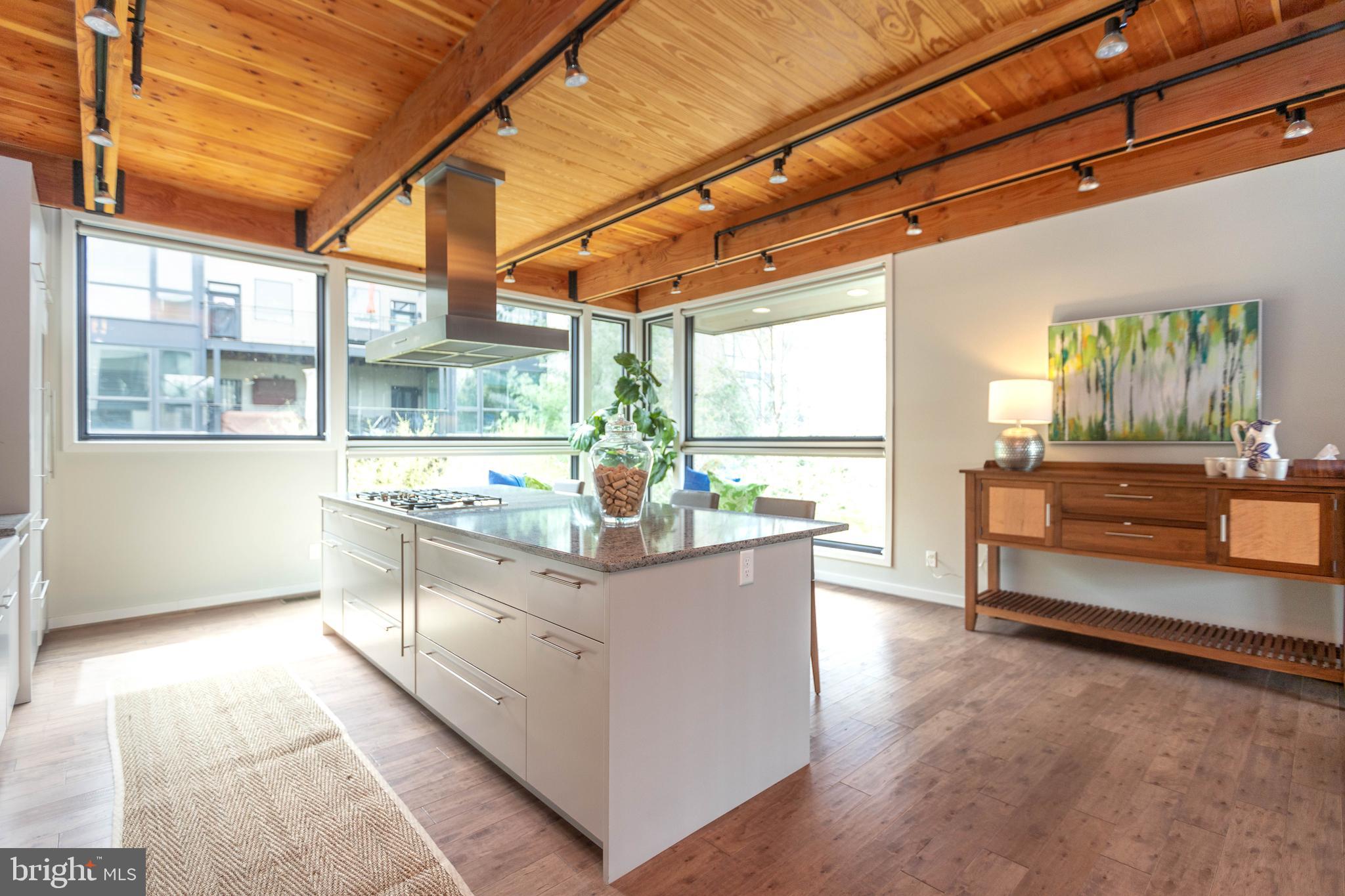 2074 Eric Shaefer Way Baltimore, MD 21211 - Photo 20 of 56 a large white kitchen with a large window