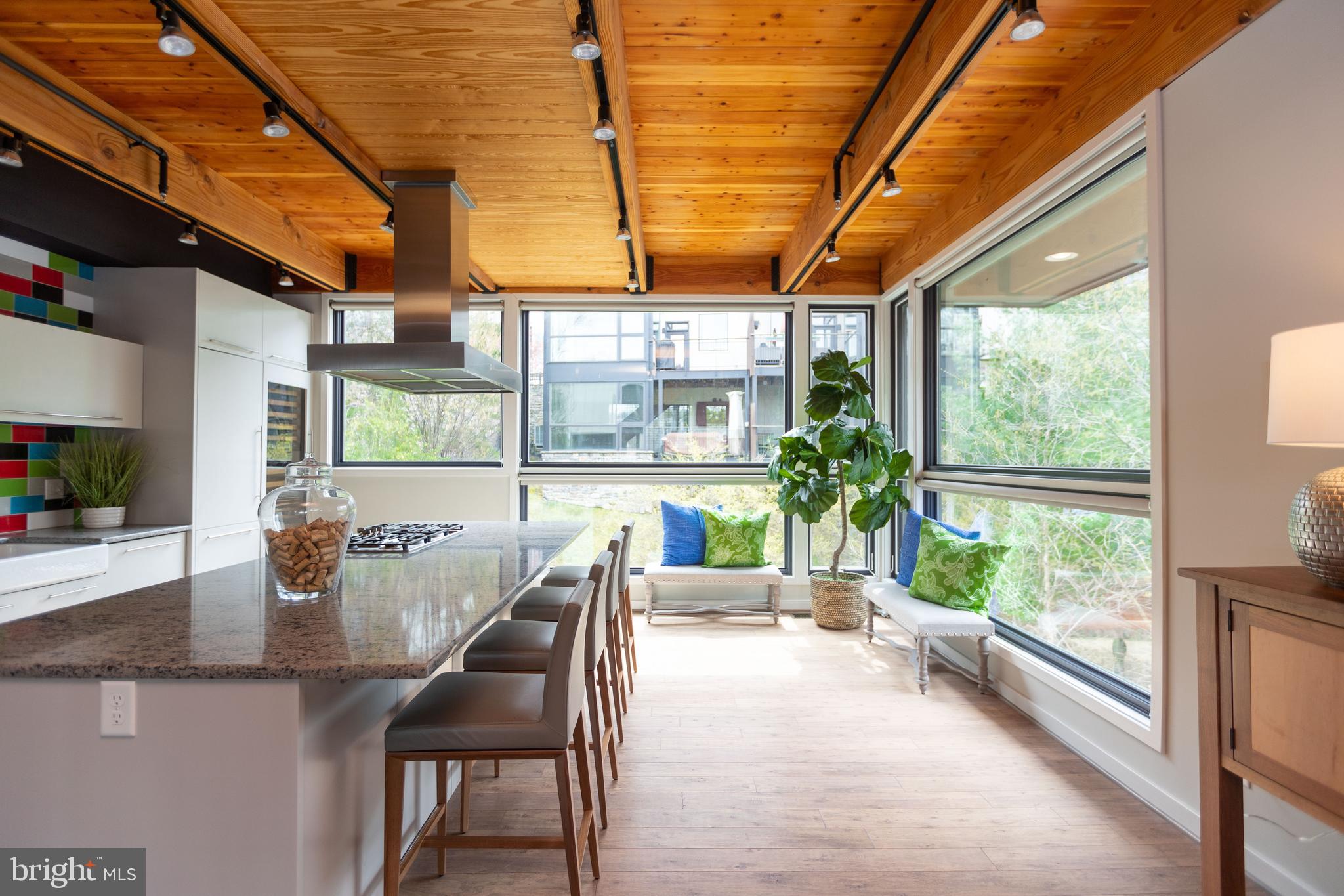 2074 Eric Shaefer Way Baltimore, MD 21211 - Photo 26 of 56 a dining room with furniture a chandelier and wooden floor