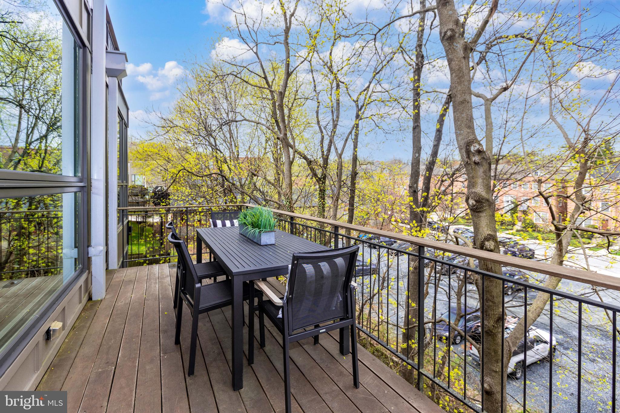 2074 Eric Shaefer Way Baltimore, MD 21211 - Photo 28 of 56 a view of a balcony with furniture and wooden floor
