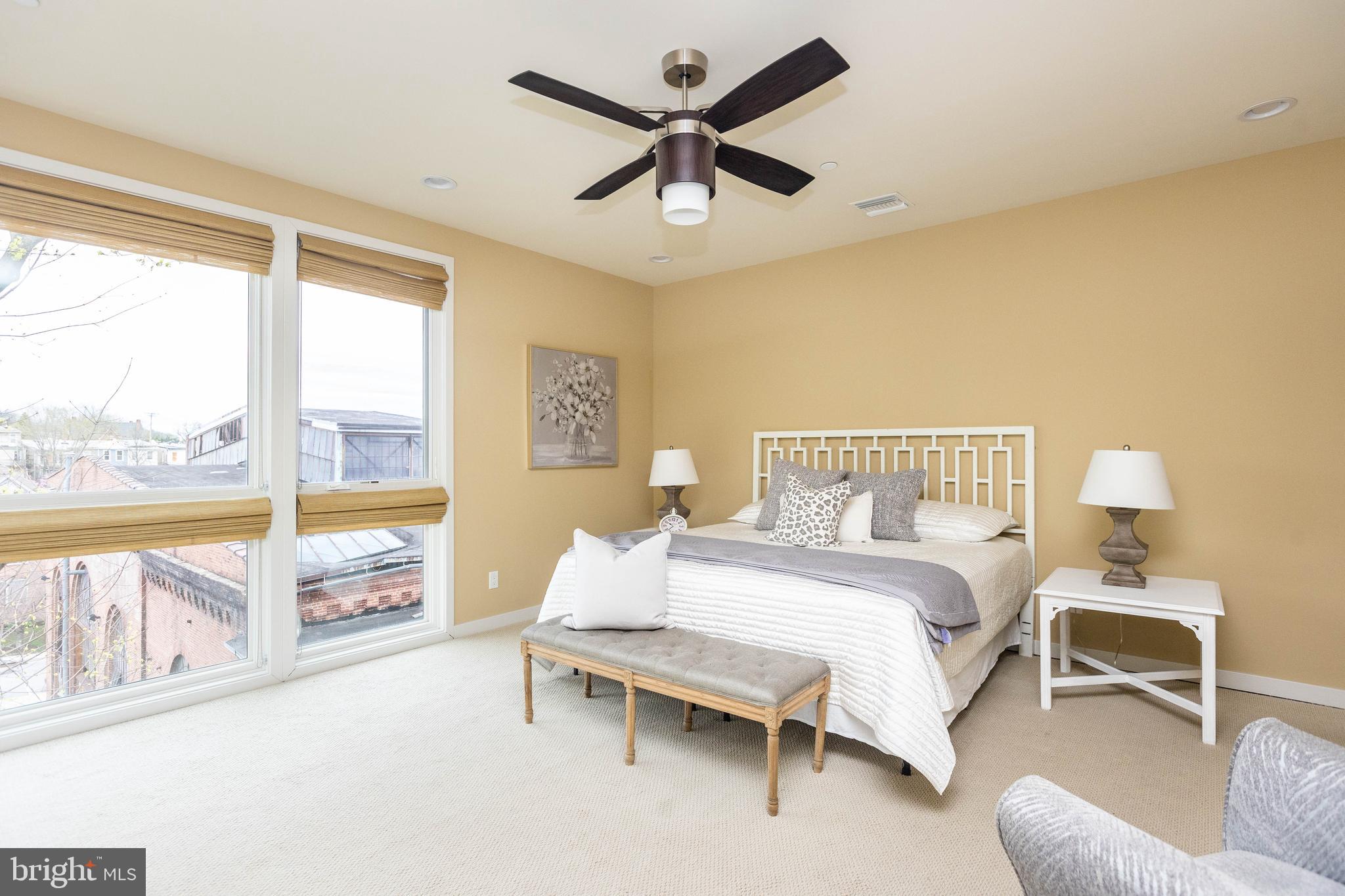 2074 Eric Shaefer Way Baltimore, MD 21211 - Photo 29 of 56 a spacious bedroom with a bed and a large window with outer view