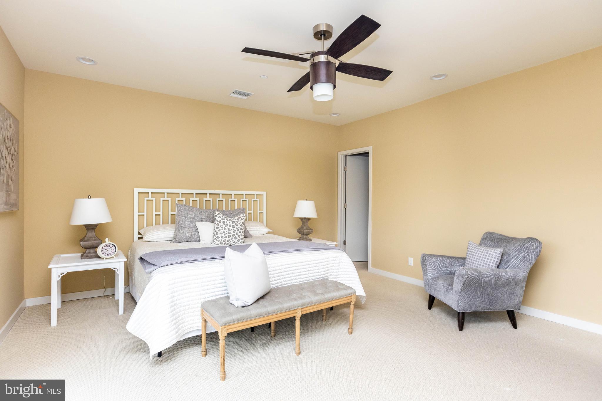 2074 Eric Shaefer Way Baltimore, MD 21211 - Photo 30 of 56 a bedroom with a bed and a chandelier