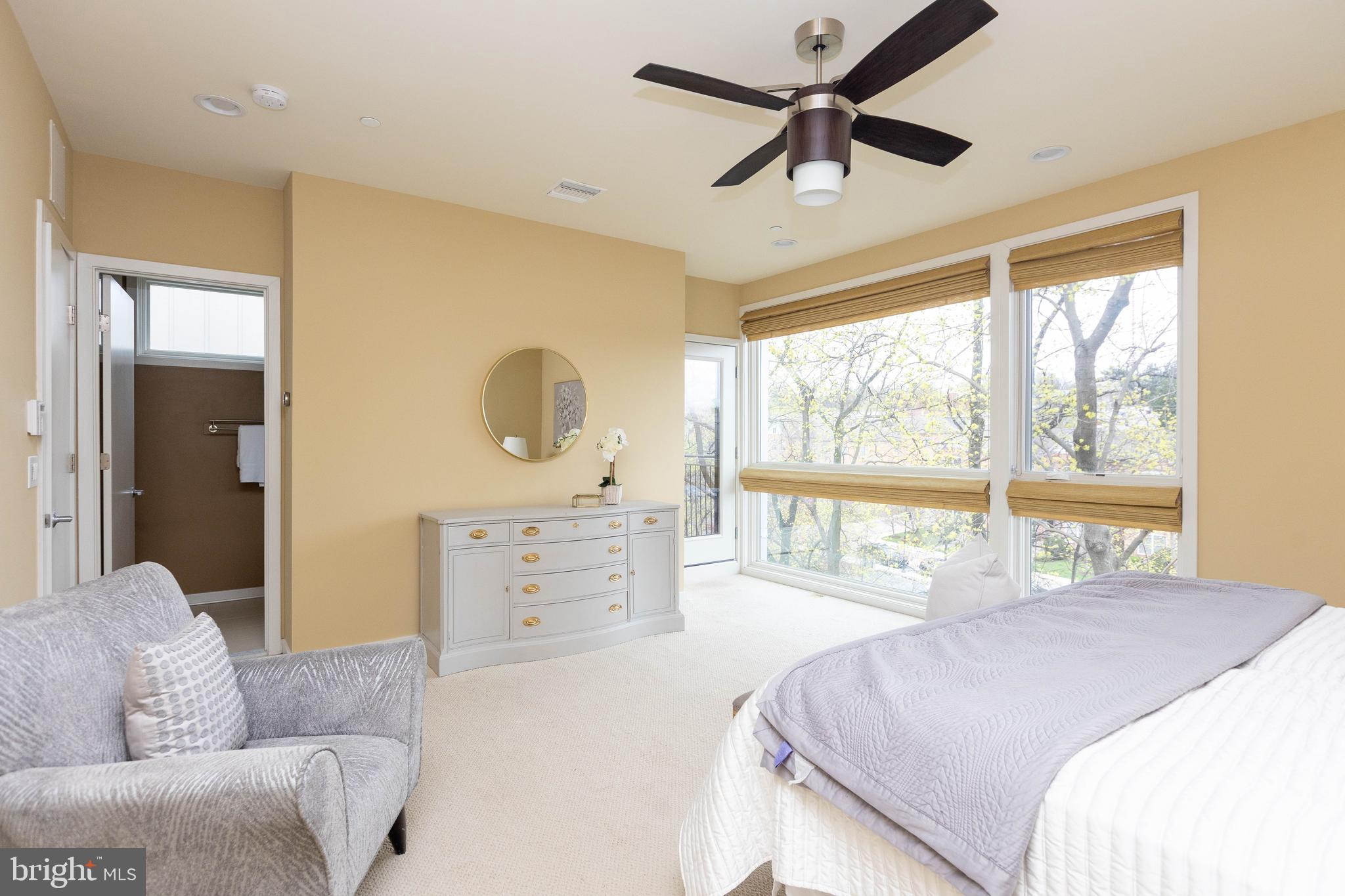 2074 Eric Shaefer Way Baltimore, MD 21211 - Photo 31 of 56 a bedroom with a bed couch and window with a flat screen tv