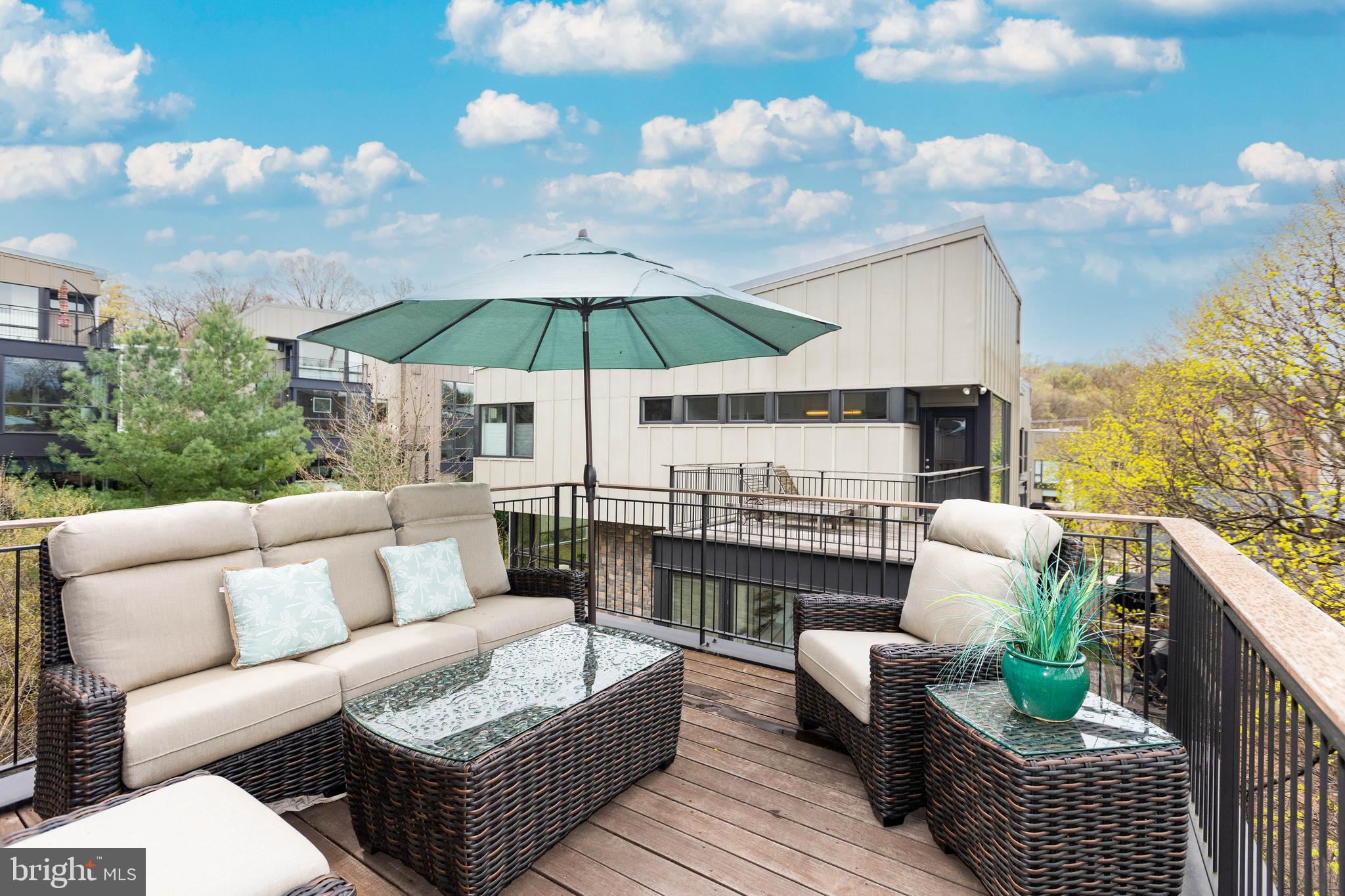 2074 Eric Shaefer Way Baltimore, MD 21211 - Photo 35 of 56 a view of a patio with couches and potted plants