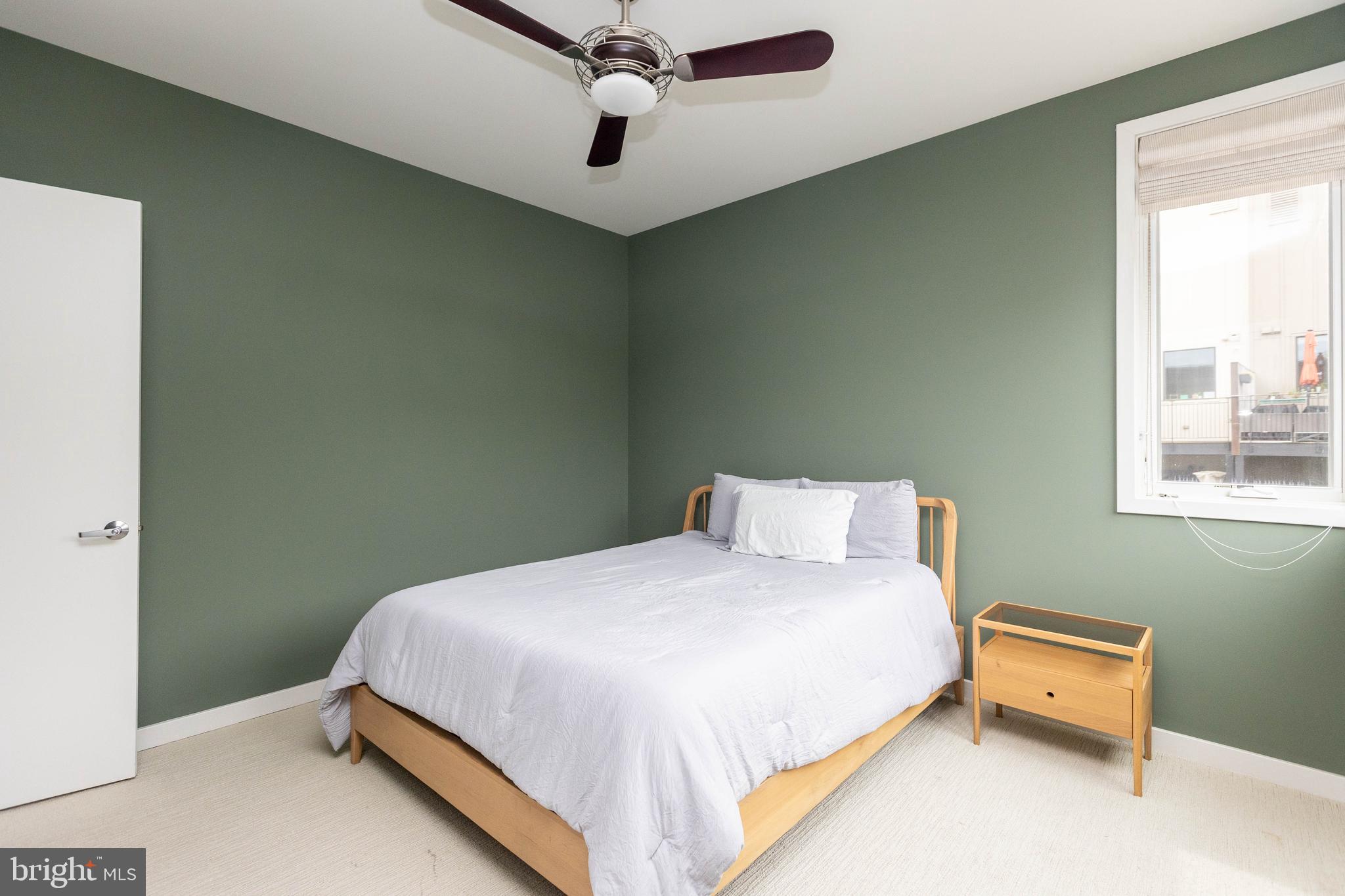 2074 Eric Shaefer Way Baltimore, MD 21211 - Photo 39 of 56 a bedroom with a bed and a window