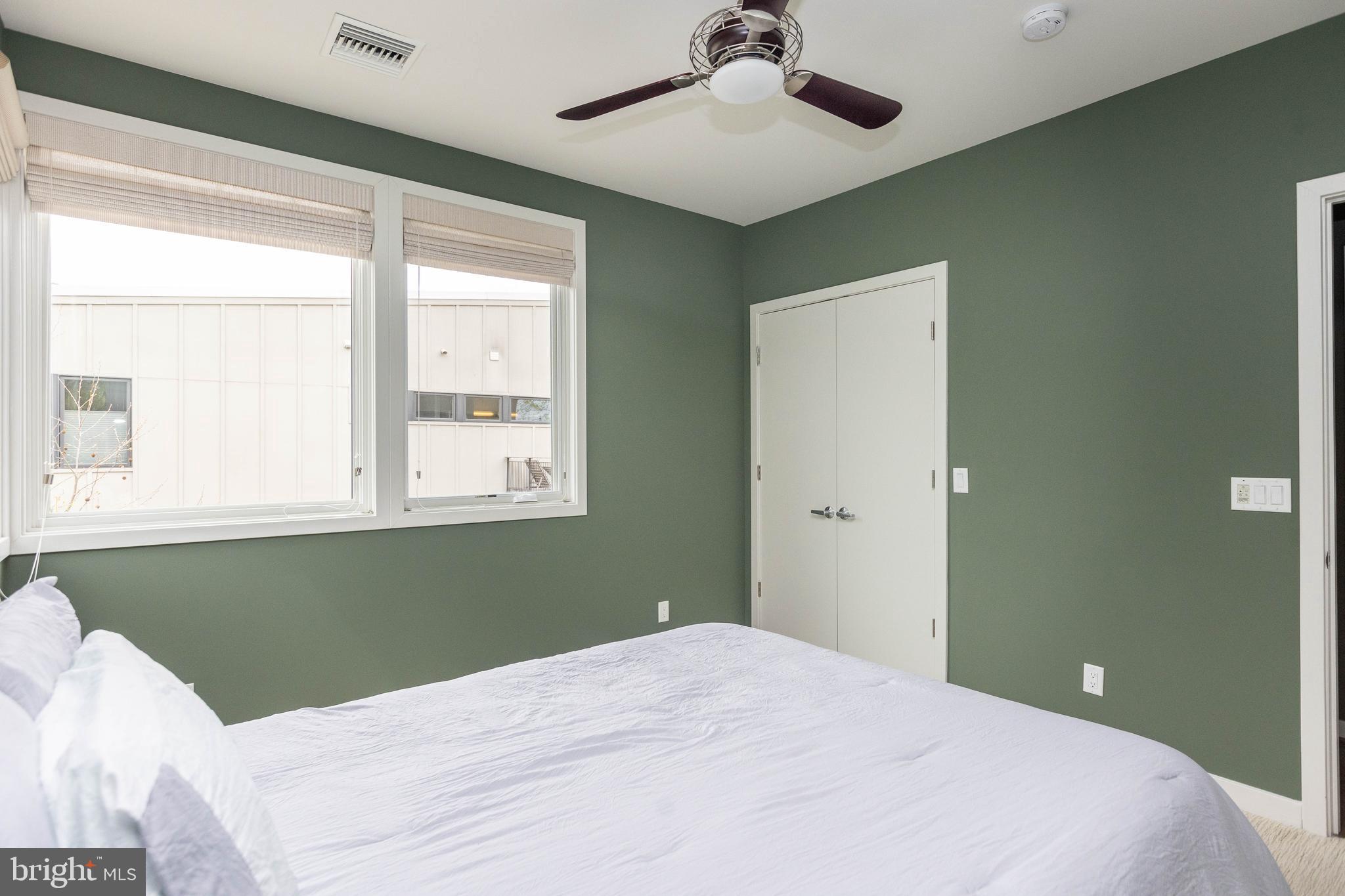 2074 Eric Shaefer Way Baltimore, MD 21211 - Photo 40 of 56 a bedroom with a bed and windows