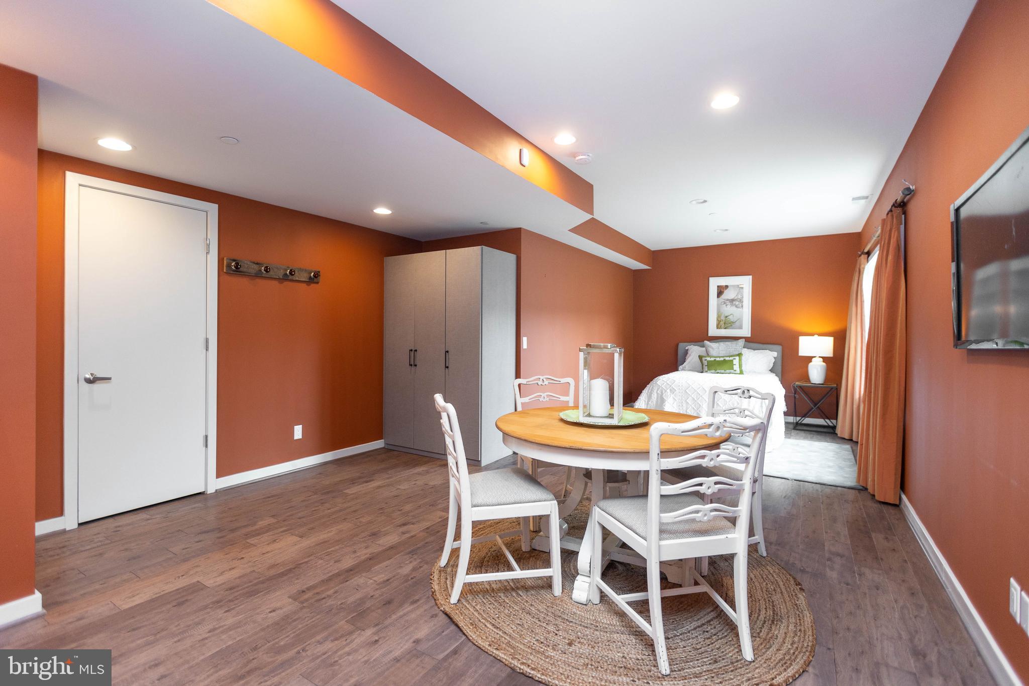 2074 Eric Shaefer Way Baltimore, MD 21211 - Photo 47 of 56 a dining room with furniture and wooden floor