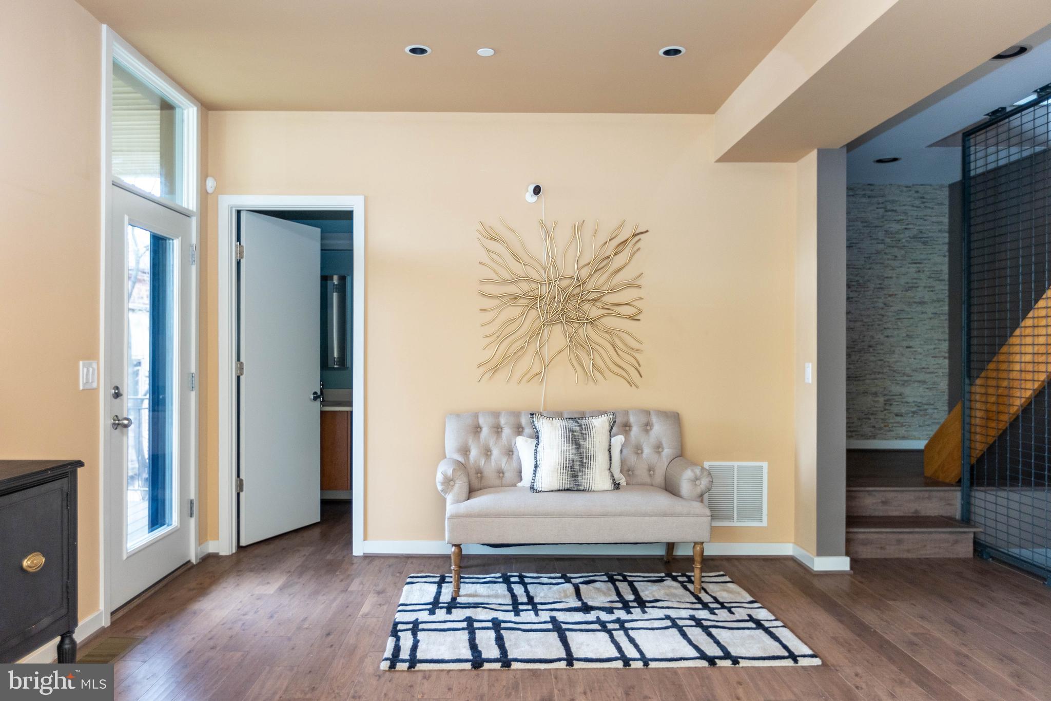 2074 Eric Shaefer Way Baltimore, MD 21211 - Photo 5 of 56 a living room with furniture and a wooden floor