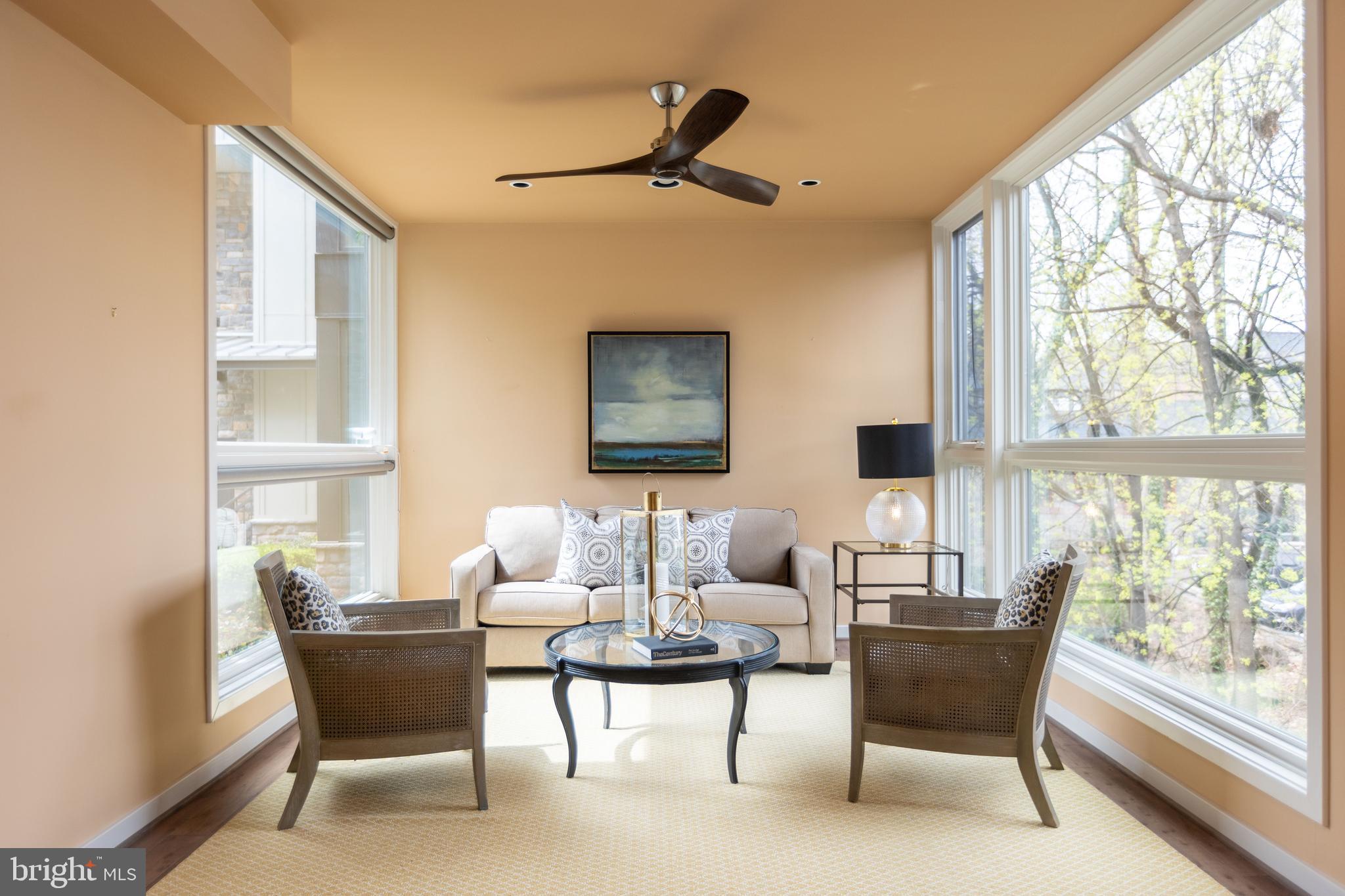 2074 Eric Shaefer Way Baltimore, MD 21211 - Photo 7 of 56 a living room with furniture a table and a large window