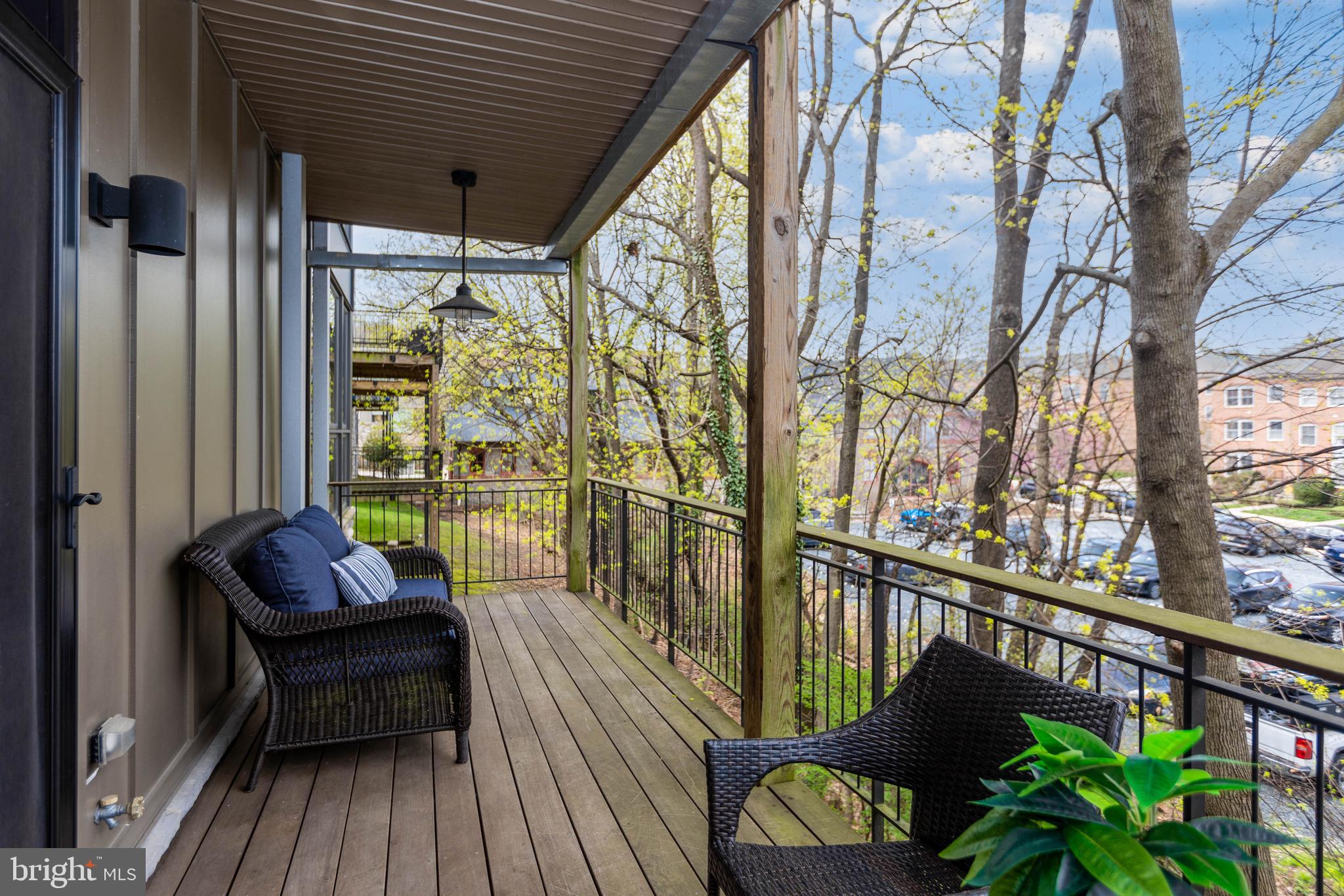 2074 Eric Shaefer Way Baltimore, MD 21211 - Photo 9 of 56 a view of a chairs on the balcony