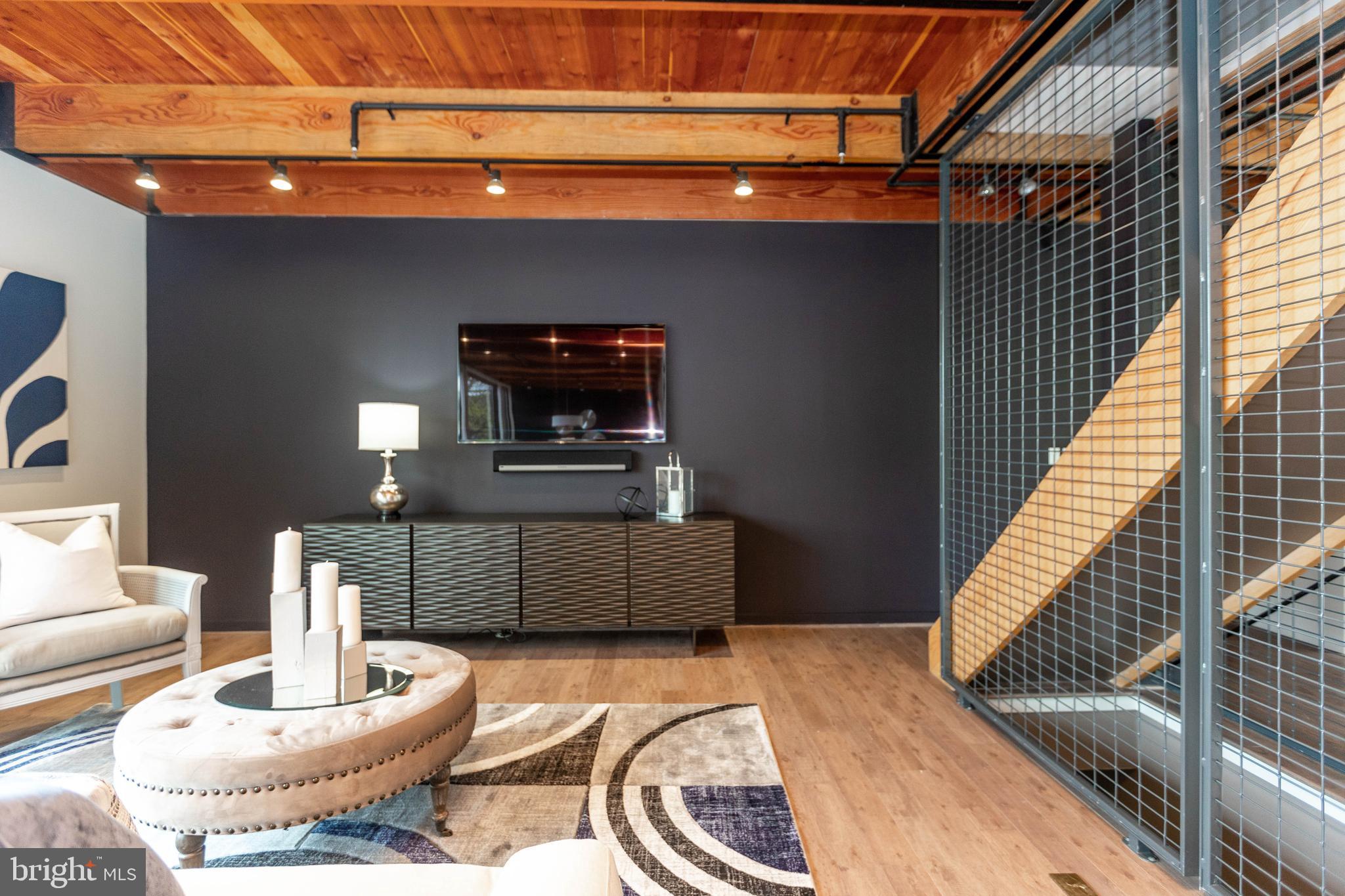 2074 Eric Shaefer Way Baltimore, MD 21211 - Photo 10 of 56 a living room with furniture and a flat screen tv