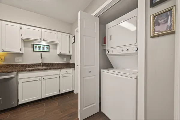 a kitchen with appliances cabinets and a sink