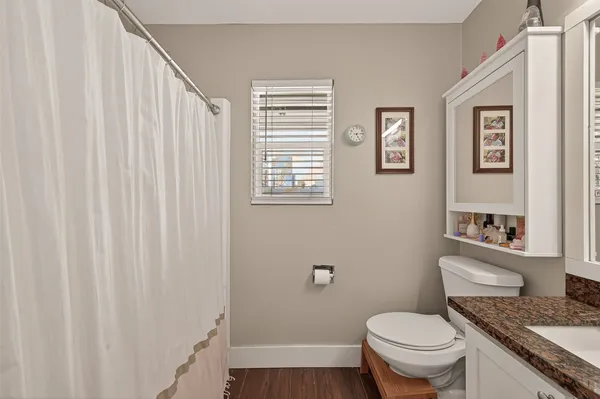 a spacious bedroom with a bed and furniture