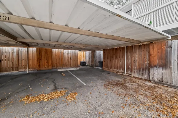 a view of a balcony with wooden floor