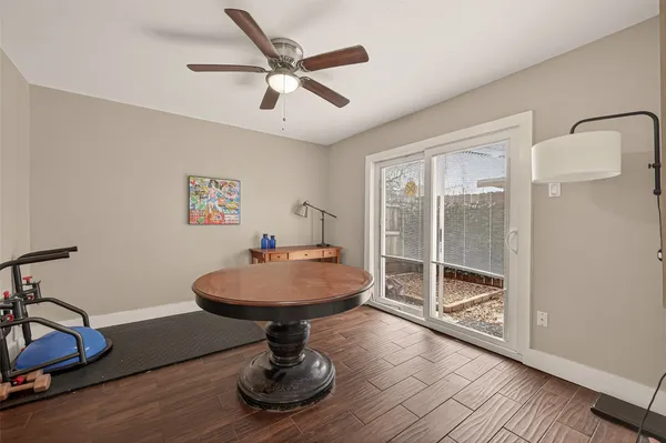 a view of a livingroom with furniture wooden floor and a chandelier