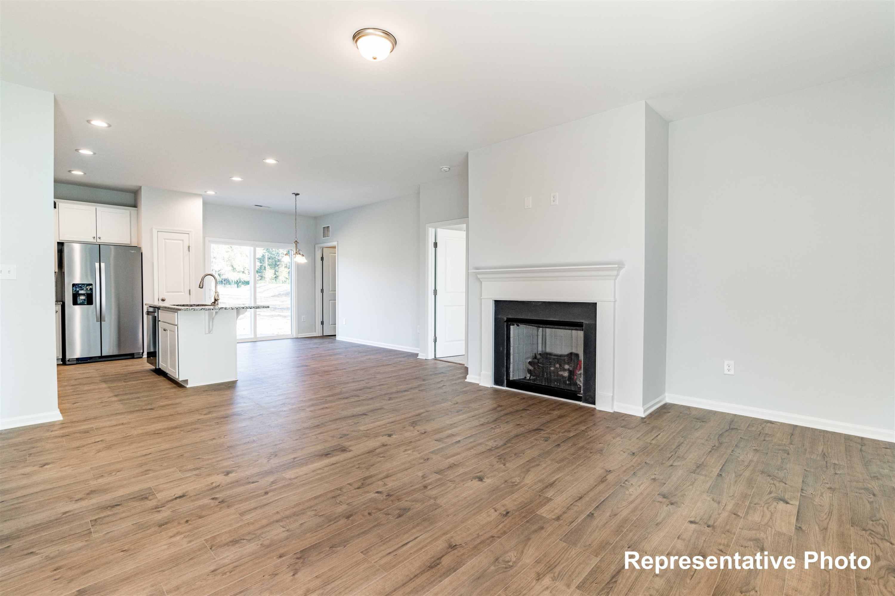 39 Longbow Drive Middlesex, NC 27557 - Photo 6 of 9 a view of a kitchen with a fireplace and a window