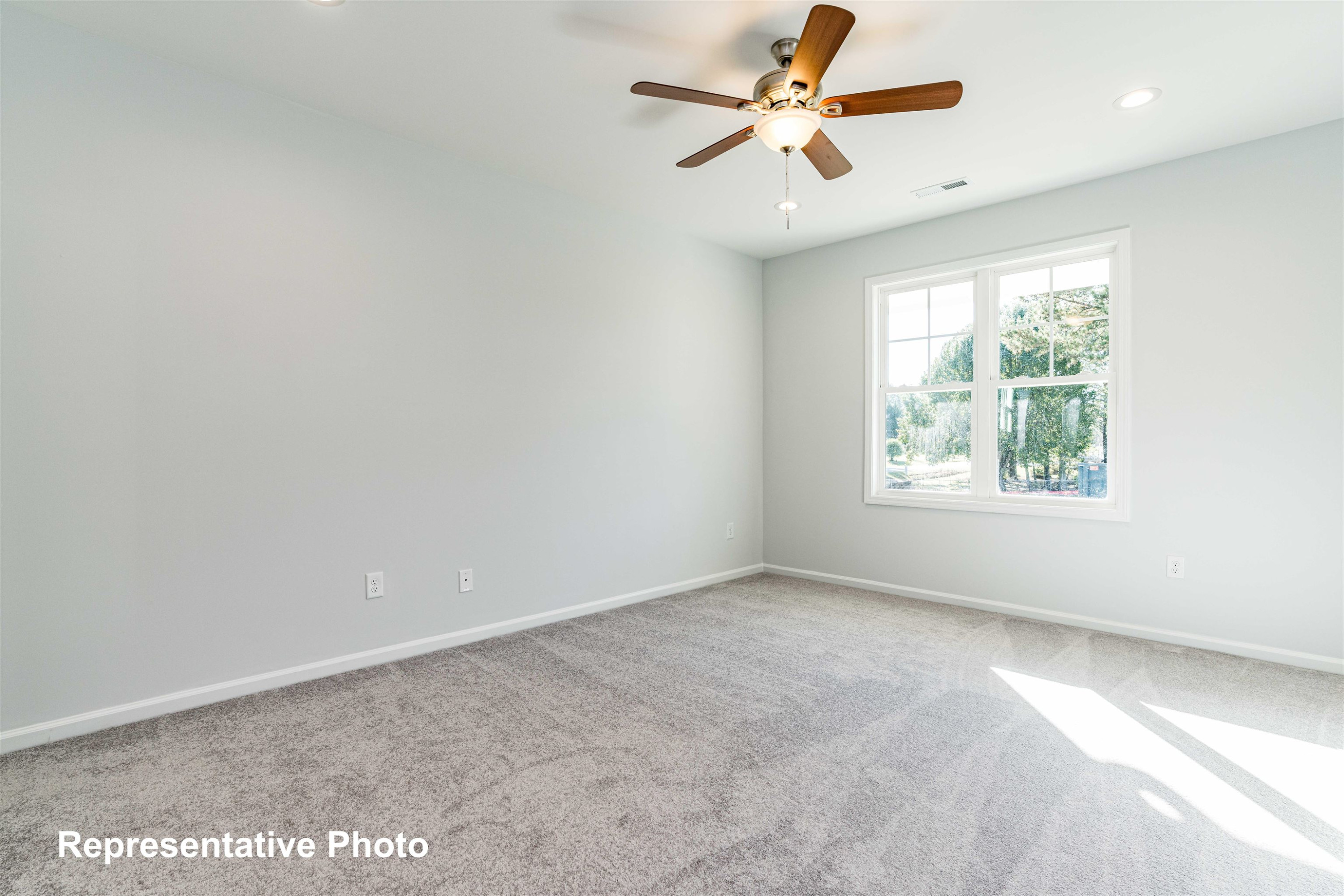 39 Longbow Drive Middlesex, NC 27557 - Photo 7 of 9 an empty room with windows and fan