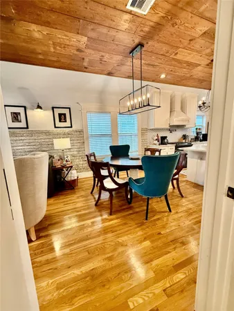 a living room with a table and chairs