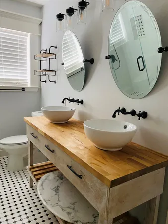 a bathroom with a sink and mirror