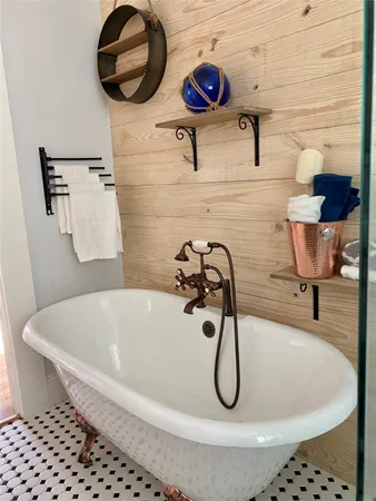 a bathroom with a tub and a shower
