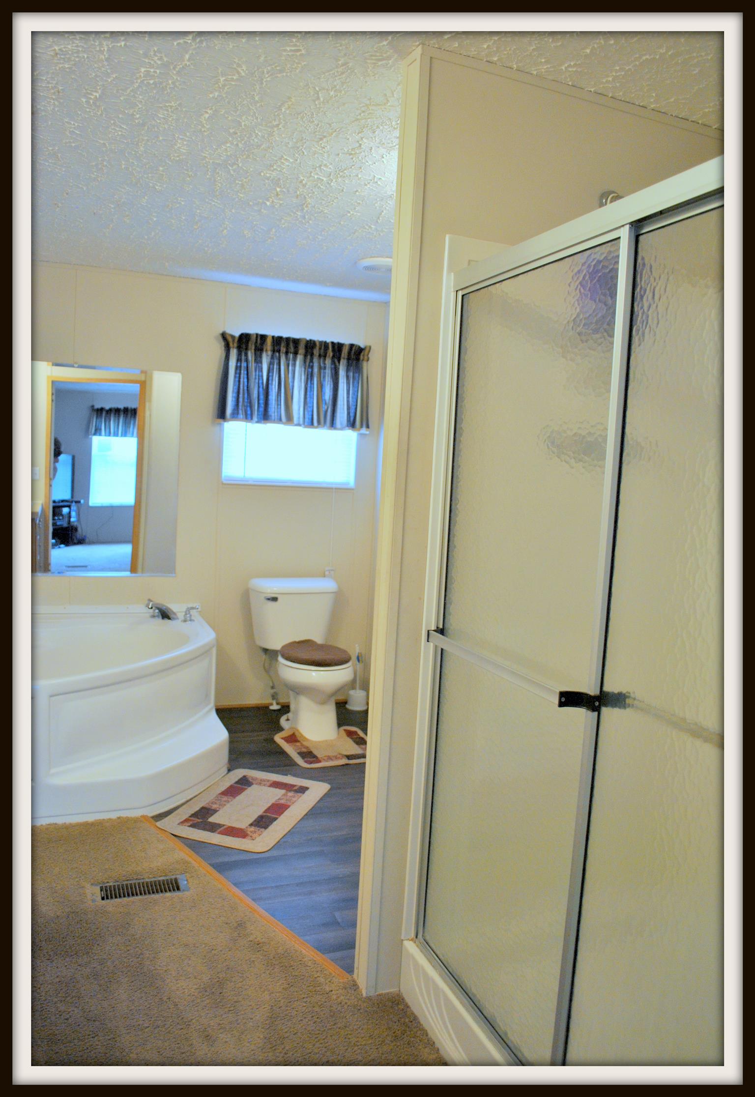 812 Dale Ridge Road Dowelltown, TN 37059 - Photo 18 of 21 a bathroom with a sink and a mirror