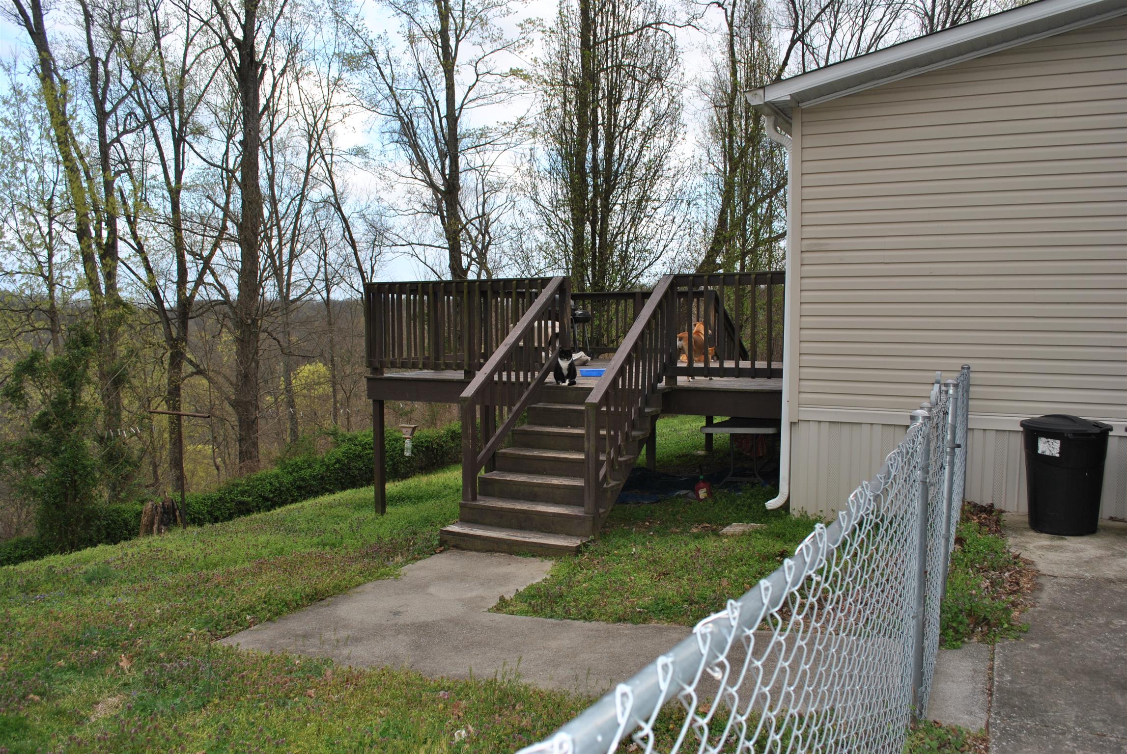812 Dale Ridge Road Dowelltown, TN 37059 - Photo 4 of 21 a front view of a house with a garden