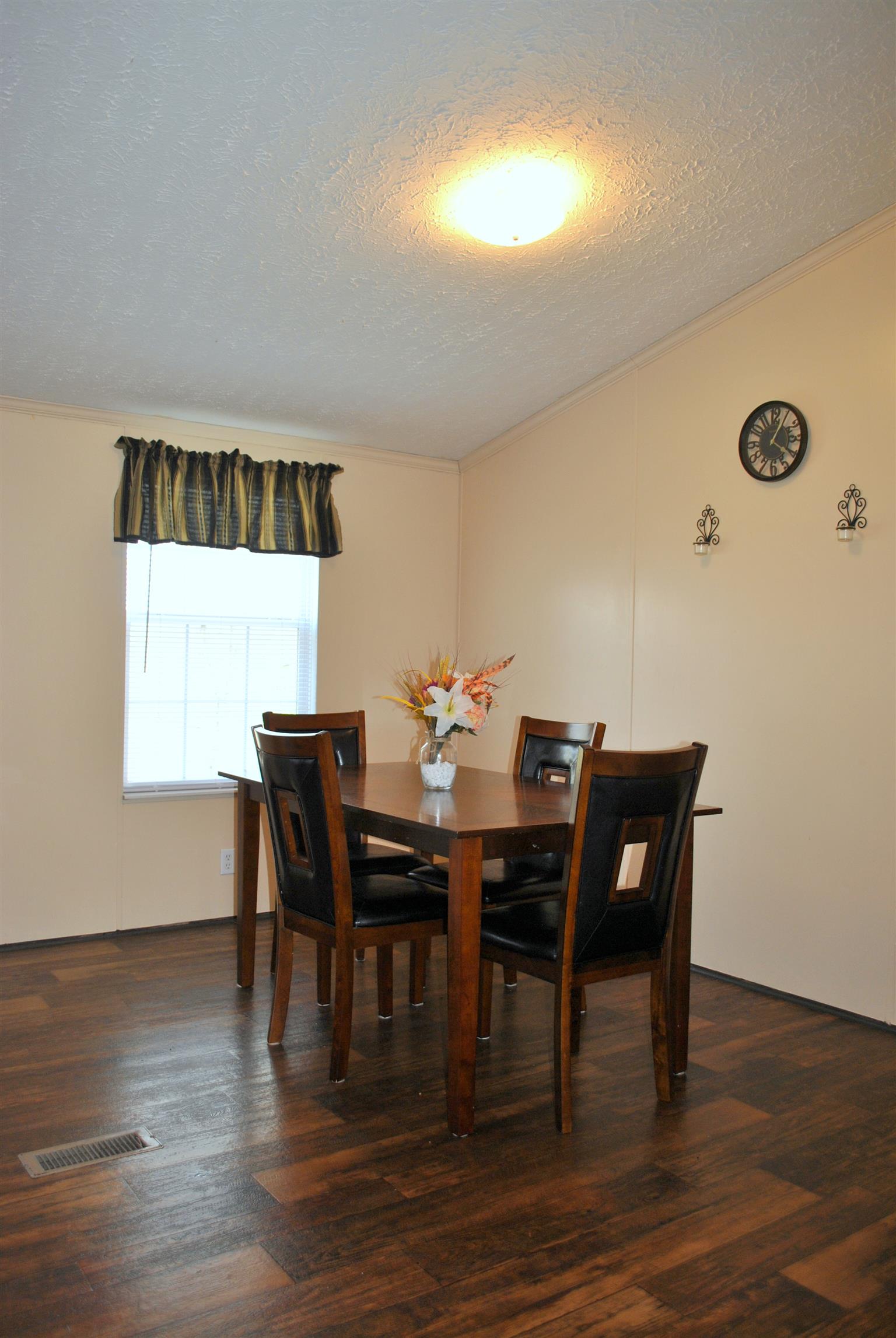 812 Dale Ridge Road Dowelltown, TN 37059 - Photo 7 of 21 a view of a dining room with furniture and wooden floor