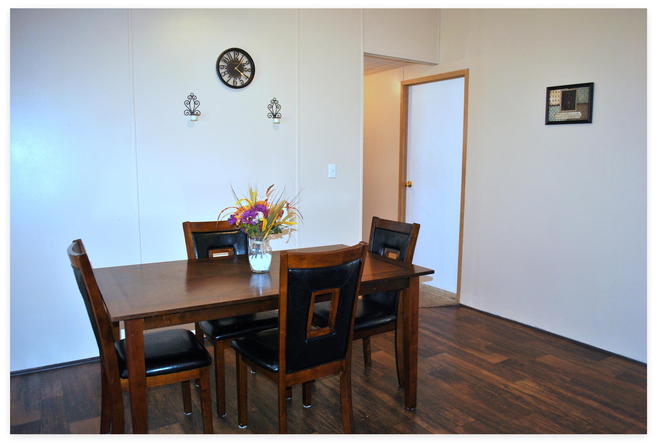 812 Dale Ridge Road Dowelltown, TN 37059 - Photo 8 of 21 a view of a dining room with furniture and wooden floor