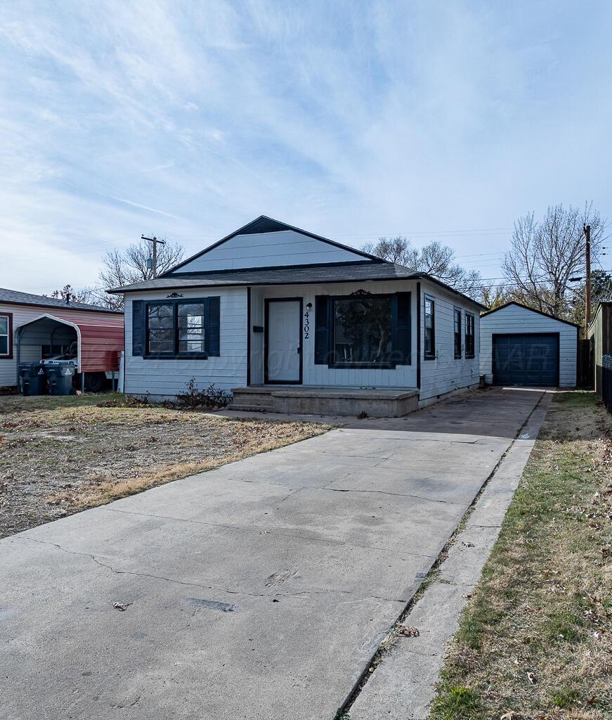 4302 South Jackson Street Amarillo, TX 79110 - Photo 15 of 16 front view of a house with a street