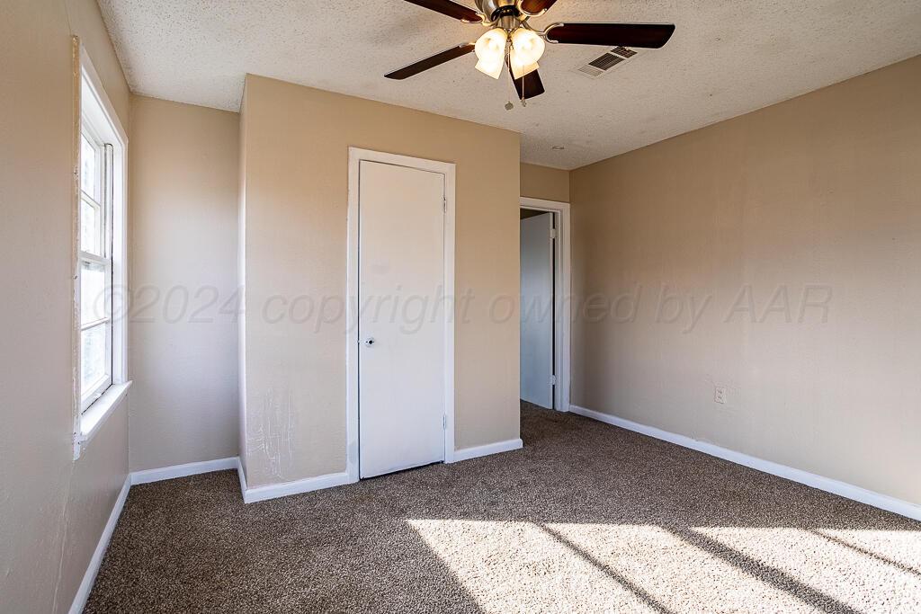 4302 South Jackson Street Amarillo, TX 79110 - Photo 16 of 16 a view of an empty room with a window