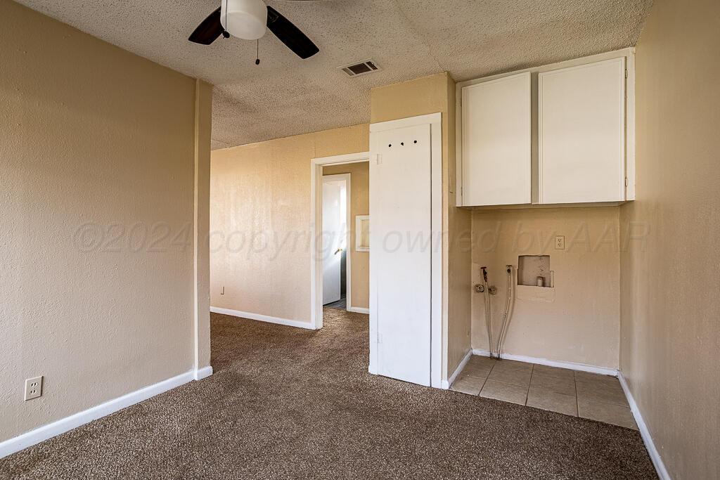 4302 South Jackson Street Amarillo, TX 79110 - Photo 5 of 16 an empty room with closet and a hallway