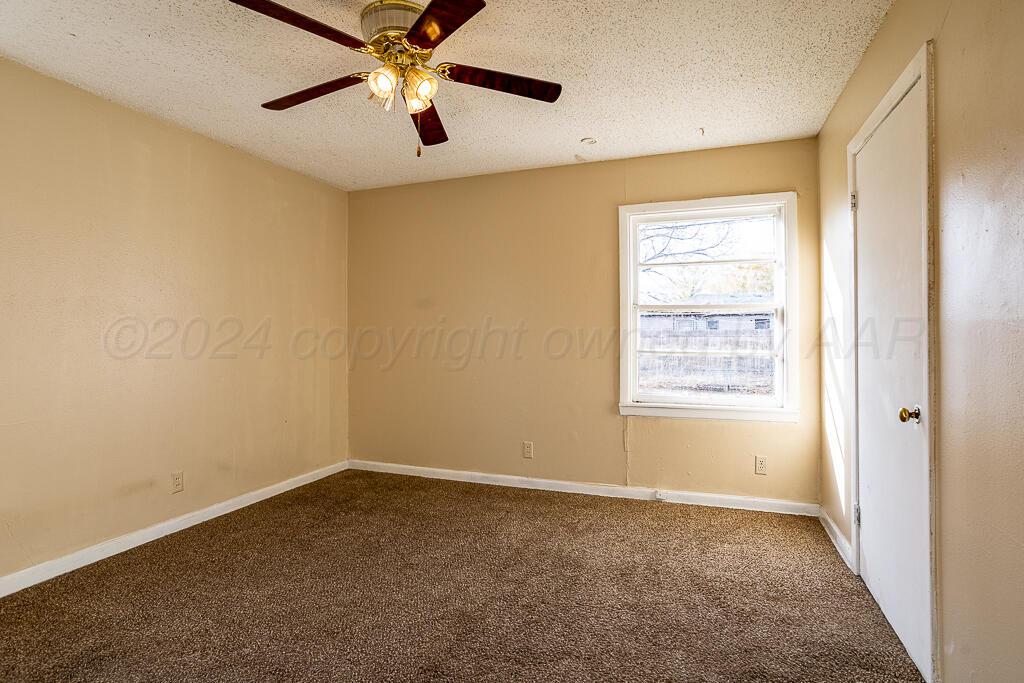 4302 South Jackson Street Amarillo, TX 79110 - Photo 9 of 16 a view of an empty room with a window