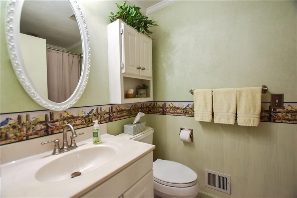 260 Fisher Road Saxonburg, PA 16056 - Photo 11 of 19 a bathroom with a toilet sink and mirror