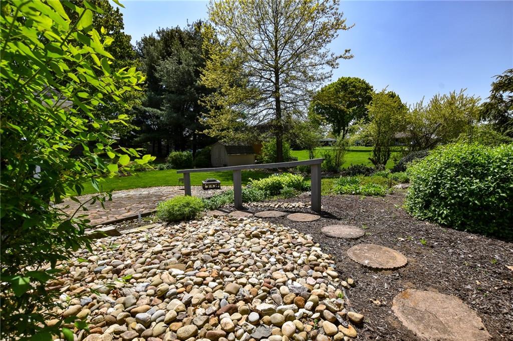 260 Fisher Road Saxonburg, PA 16056 - Photo 18 of 19 a big yard with lots of green space and plants