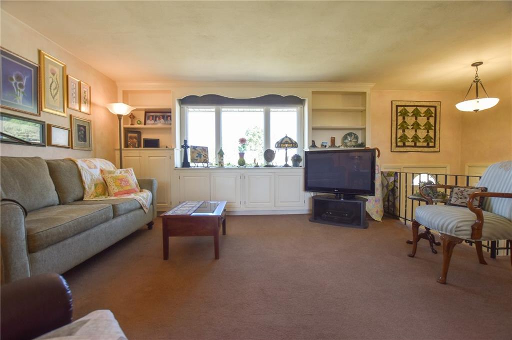 260 Fisher Road Saxonburg, PA 16056 - Photo 4 of 19 a living room with furniture and a lamp