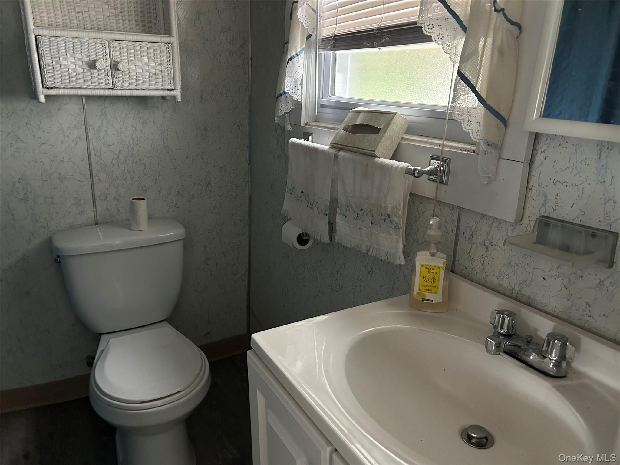 52 Greentree Road, Unit 12A Monticello, NY 12701 - Photo 7 of 11 a bathroom with a sink and a toilet
