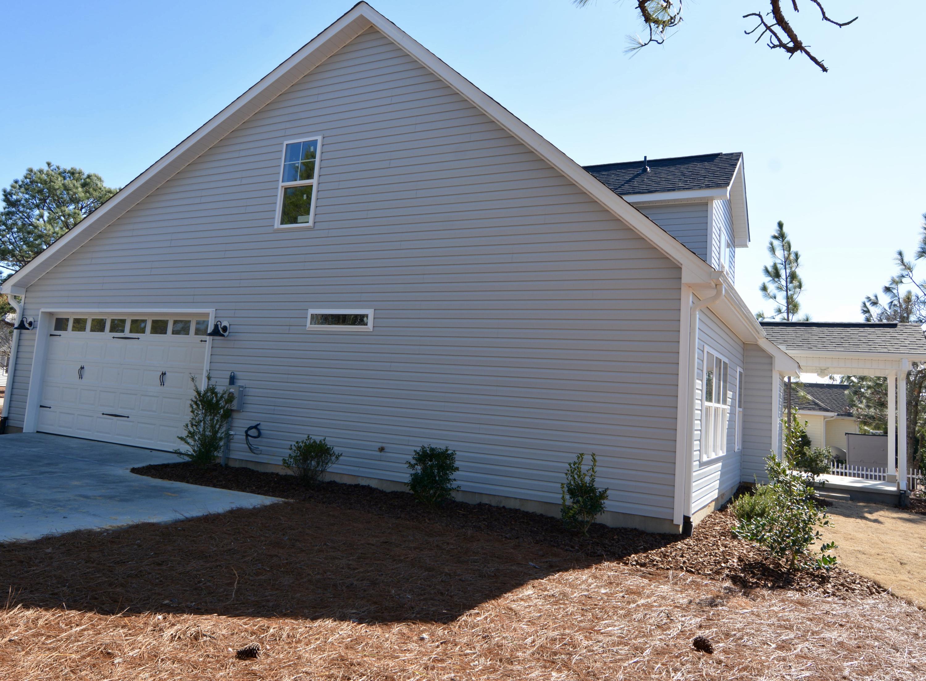 1365 Burning Tree Road Pinehurst, NC 28374 - Photo 4 of 8 Side View with side entrance garage.