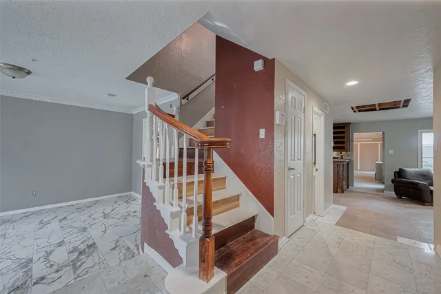 a view of entryway livingroom and hall