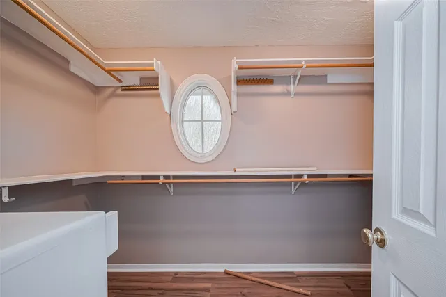 a close view of closet with wooden floor