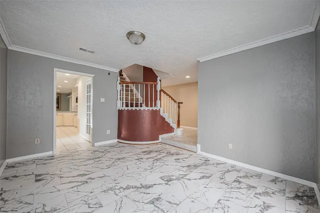 a view of a hallway with a chandelier