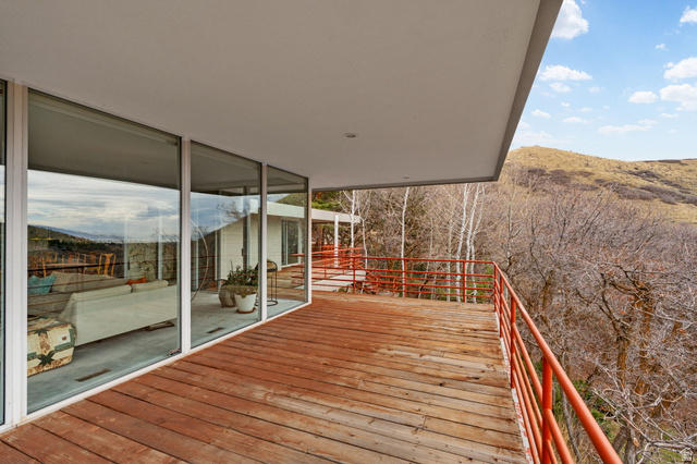 1856 Fort Canyon Road Alpine, UT 84004 - Photo 48 of 49 Expansive wood-plank deck with a vibrant orange railing