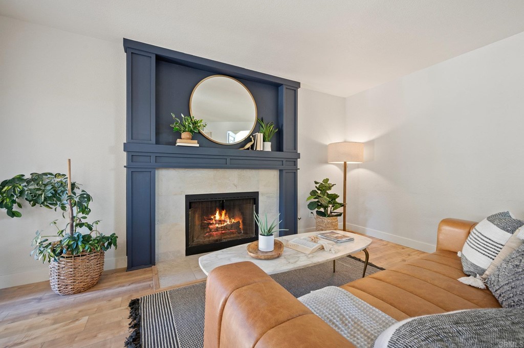 1740 Avenida Segovia Oceanside, CA 92056 - Photo 13 of 40 a living room with furniture and a fireplace
