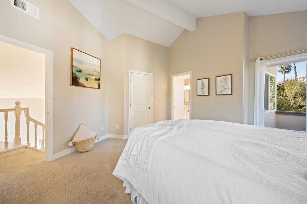 1740 Avenida Segovia Oceanside, CA 92056 - Photo 18 of 40 a bedroom with a bed and a couch