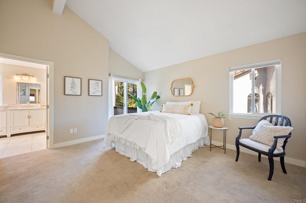 1740 Avenida Segovia Oceanside, CA 92056 - Photo 19 of 40 a bedroom with a bed and a chair