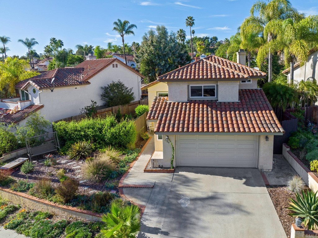 1740 Avenida Segovia Oceanside, CA 92056 - Photo 2 of 40 a front view of a house with a yard