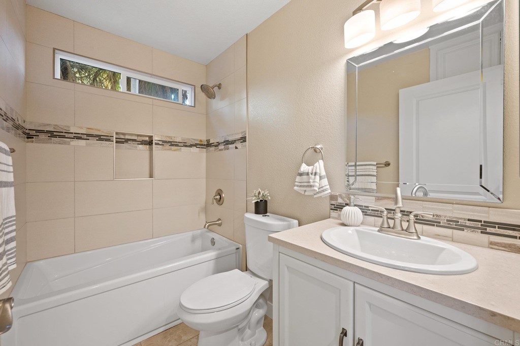 1740 Avenida Segovia Oceanside, CA 92056 - Photo 23 of 40 a bathroom with a sink toilet and a bathtub