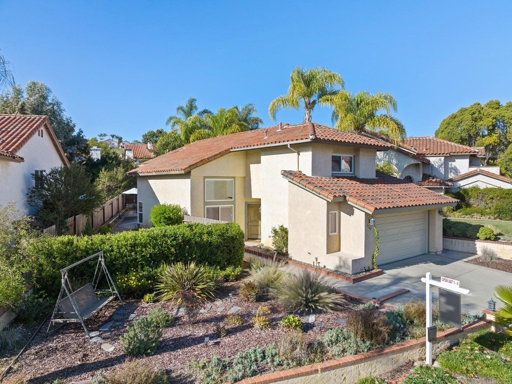 1740 Avenida Segovia Oceanside, CA 92056 - Photo 3 of 40 a front view of a house with garden