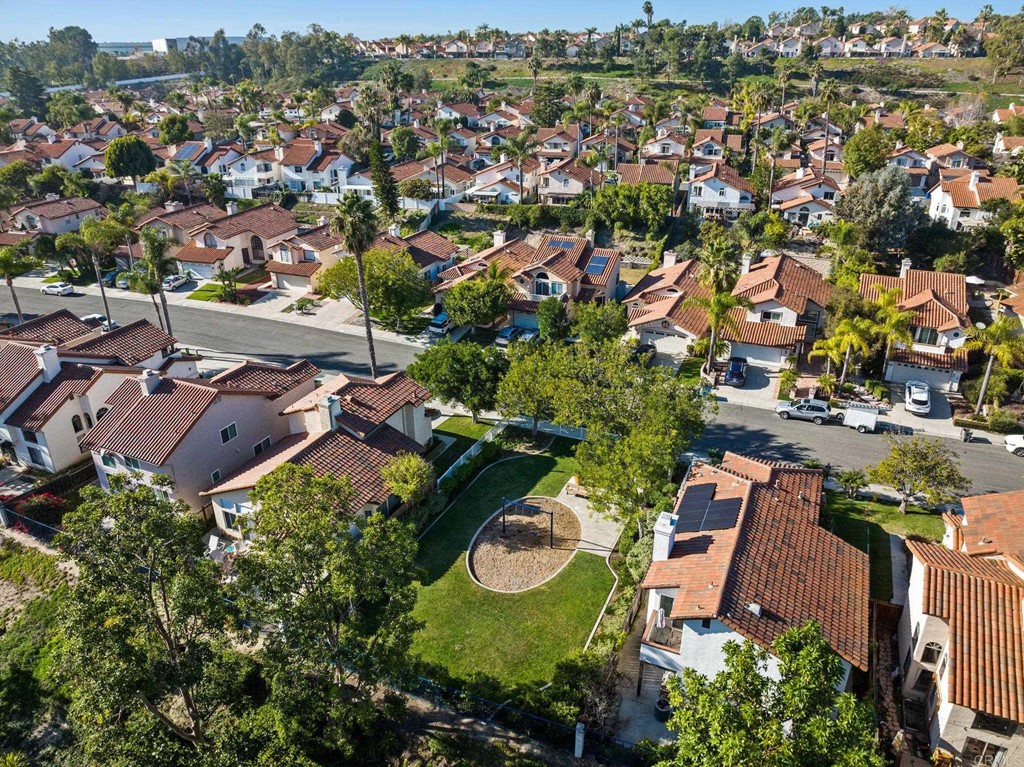 1740 Avenida Segovia Oceanside, CA 92056 - Photo 32 of 40 an aerial view of residential houses with outdoor space and trees all around