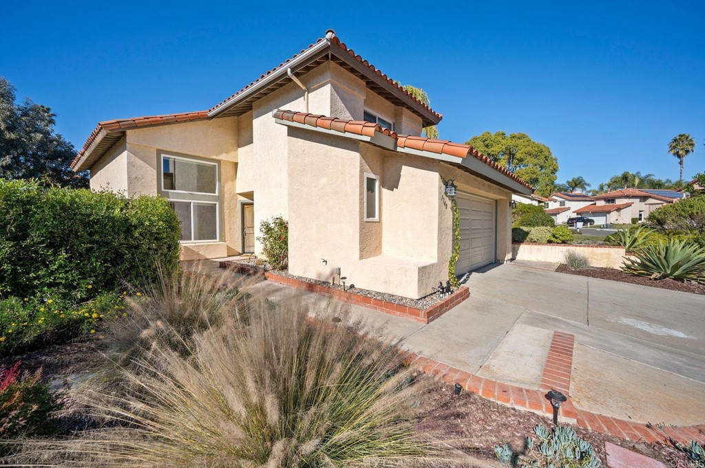 1740 Avenida Segovia Oceanside, CA 92056 - Photo 4 of 40 a view of a house with a yard